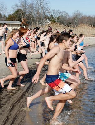 Tabor Academy Polar Plunge
Tabor Academy hosted its second annual Polar Plunge on Sunday, January 21 at Silvershell Beach to raise money for the school’s Special Olympics Young Athletes Program. Students from ‘fundraising rival’ Sandwich High also showed up, with scores of students and staff making a dash in and quickly out of the chilly waters. The plunge raised about $8,000. Photos by Deina Zartman
