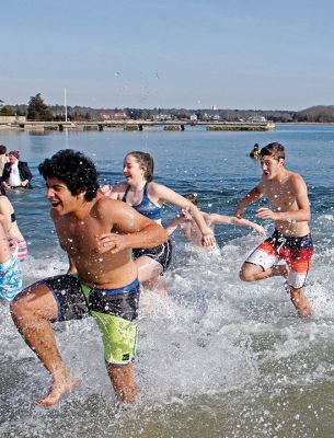 Tabor Academy Polar Plunge
Tabor Academy hosted its second annual Polar Plunge on Sunday, January 21 at Silvershell Beach to raise money for the school’s Special Olympics Young Athletes Program. Students from ‘fundraising rival’ Sandwich High also showed up, with scores of students and staff making a dash in and quickly out of the chilly waters. The plunge raised about $8,000. Photos by Deina Zartman
