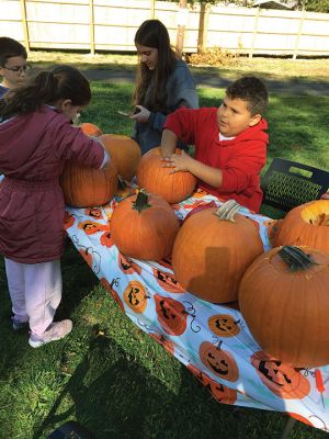 Saturday’s Pumpkin Palooza hosted by the Marion Council of Aging and the Recreation Department at the Cushing Community Center. Families decorated pumpkins, and children enjoyed face painting, a hula-hoop contest, dancing, a visit from Pine Meadow Farm animals and refreshments supported by Tabor Academy volunteers. Pumpkins were later illuminated, giving the pavilion an eerie weekend presence. Sixty-five families preregistered to participate in the event inspired by Marion citizen Dianne Cosman
