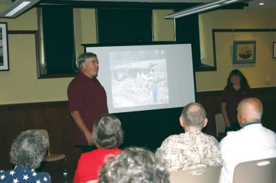 From Purgatory to Podunk
Debbie and Pete Lincoln presented "From Purgatory to Podunk" to a full house at the Mattapoisett Library on September 14, 2011. The presentation profiled the couple's mission to visit all 351 cities and towns in Massachusetts. Photo courtesy of Susan Pizzolato. 
