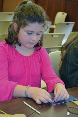 Quilled Out
Local kids ‘quilled out’ at the Mattapoisett Library on Saturday, November 4, with Children’s Services Director Jeanne McCullough, who passed on her quilling skills (a.k.a. paper filigree) to a group of eager new ‘quillers.’ Photos by Jean Perry
