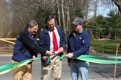 Rail Trail
Bill Straus, State Representative, Steve Kelleher, Chairman of Mattapoisett Rail Trail, and Jordan Collyer, Vice-Chairman of the Mattapoisett Board of Selectman (left to right) cut the ribbon to open the Inauguration of the Mattapoisett Rail Trails Old Colony Mile. Photo by Sarah K. Taylor. 
