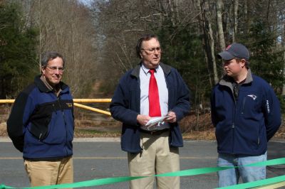 Rail Trail
Bill Straus, State Representative, Steve Kelleher, Chairman of Mattapoisett Rail Trail, and Jordan Collyer, Vice-Chairman of the Mattapoisett Board of Selectman (left to right) cut the ribbon to open the Inauguration of the Mattapoisett Rail Trails Old Colony Mile. Photo by Sarah K. Taylor. 
