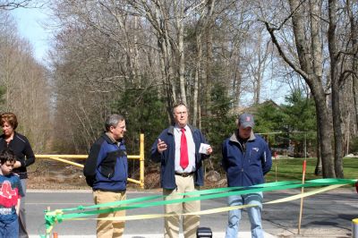 Rail Trail
Bill Straus, State Representative, Steve Kelleher, Chairman of Mattapoisett Rail Trail, and Jordan Collyer, Vice-Chairman of the Mattapoisett Board of Selectman (left to right) cut the ribbon to open the Inauguration of the Mattapoisett Rail Trails Old Colony Mile. Photo by Sarah K. Taylor. 
