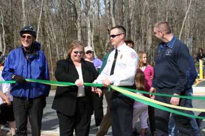 Rail Trail
Bill Straus, State Representative, Steve Kelleher, Chairman of Mattapoisett Rail Trail, and Jordan Collyer, Vice-Chairman of the Mattapoisett Board of Selectman (left to right) cut the ribbon to open the Inauguration of the Mattapoisett Rail Trails Old Colony Mile. Photo by Sarah K. Taylor. 
