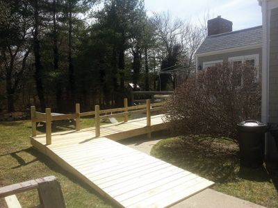 Ramp Construction
Andy Bobola of the Mattapoisett Building Department, Bruce Rocha Jr. of Fisher and Rocha and the Mattapoisett Lions Club recently collaborated on building this handicap ramp 
