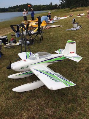 Bristol County Radio Control Club 
Members of the Bristol County Radio Control Club gathered on August 20 at Mary's Pond in Rochester for the annual fun fly of radio-controlled pontoon airplanes. Nationally, there are several thousand recognized clubs engaged in the activity, said Ned Watts, an avid pilot of the Styrofoam craft. Ruth Nicolaci of Marion, whose husband John helped found the club, was on hand to enjoy the event. Photos by Marilou Newell
