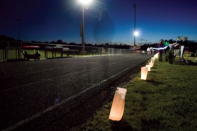 Relay for Life
Over 200 Tri-Town residents gathered to help raise money for the American Cancer Society by participating in the fifth annual Relay for Life. The Relay started at 5:00 pm on Friday June 11 and continued until 12:00 pm on Saturday. Participants walked the track at ORR throughout the night and into the next afternoon as a way to honor cancer survivors and those who lost their battle to cancer. Personalized luminaria bags lined the track, lighting the way for the participants throughout the night.
