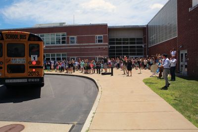 Rochester Memorial School
Rochester Memorial School students enjoyed their farewell to the 2022-23 school year on June 24, as RMS held its rowdy tradition featuring a faculty and staff orchestra serenading in song. Bus drivers took extra laps around the loop to the cheers of their families, as the children waved. Photos by Mick Colageo
