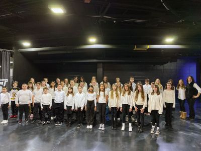 Rochester Memorial School
Over 40 Rochester Memorial School fifth- and sixth-grade chorus students sang the national anthem before the January 14 Providence Bruins game. Among those having a good time at the good ol’ hockey game are sixth-grader Hayden Silva, the Realini family, Grade 5 teacher Mike Forns and Music and Chorus teacher Susan Audette. Photos courtesy ORR District
