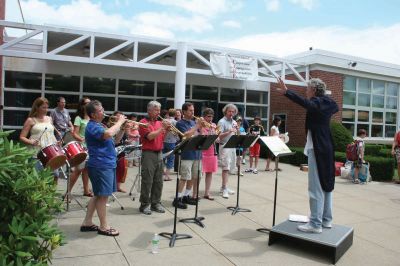 Summer Serenade 
Teachers sang and played instruments at Rochester Memorial School on June 18, 2010, the last day of school, as students waved goodbye from their school buses. Photo by Laura Pedulli.
