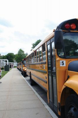 Summer Serenade 
Teachers sang and played instruments at Rochester Memorial School on June 18, 2010, the last day of school, as students waved goodbye from their school buses. Photo by Laura Pedulli.
