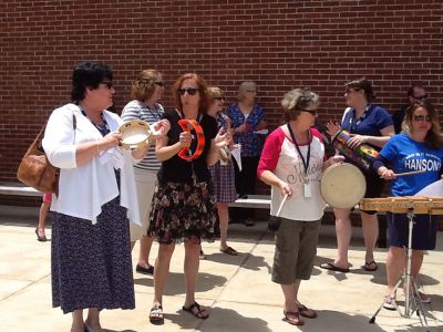 RMS Send Off
Every year on the last day of school, Rochester Memorial School staff and faculty members give their students a VIP send-off to bid them farewell for the summer. Buses circle the parking lot and staff play music while students frantically wave goodbye from the passing buses. By Jean Perry
