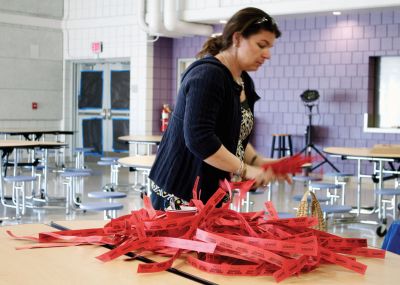 RMS-PTO Annual Auction
PTO member Jenn Hunter organizes tickets for the raffle table. Photo by Eric Trippoli
