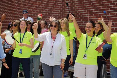 Last Day of School
June 19 was the last day of school at RMS, and the teachers and staff celebrated with their traditional student sendoff. Conductor Danni Kleiman led the teachers in song as the busses full of waving students looped around the parking lot before heading off toward summer break. Photos by Jean Perry
