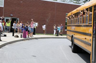 Last Day of School
June 19 was the last day of school at RMS, and the teachers and staff celebrated with their traditional student sendoff. Conductor Danni Kleiman led the teachers in song as the busses full of waving students looped around the parking lot before heading off toward summer break. Photos by Jean Perry
