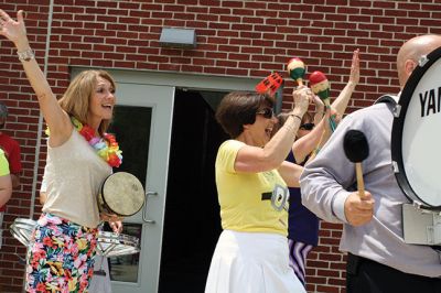 Last Day of School
June 19 was the last day of school at RMS, and the teachers and staff celebrated with their traditional student sendoff. Conductor Danni Kleiman led the teachers in song as the busses full of waving students looped around the parking lot before heading off toward summer break. Photos by Jean Perry
