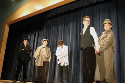 Sherlock Holmes at RMS
“The game is afoot” at Rochester Memorial School with its annual spring drama production! This year director Karen Della Cioppa has brought to the stage our favorite “the professor of facts,” Sherlock Holmes, and his assistant, Dr. John Watson, starring Ambrose Cole as Holmes and Nolan Bushnell as Watson. Watch as Holmes and Watson uncover another dark mystery in an adaptation of “Sherlock Holmes: Mystery at the Manor”, this Friday, May 3, at 7:00 pm in the RMS cafetorium. Photos by Jean Perry

