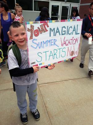 Rochester Memorial School 
As the school doors opened at Rochester Memorial School on the afternoon of Friday, June 14, teachers and administration carried on the tradition of playing instruments as a final farewell to the students as the school buses circled the parking lot, honking, as students laughed, waved, and cheered. Photos by Michelle Lynds
