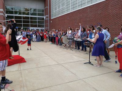 Rochester Memorial School 
As the school doors opened at Rochester Memorial School on the afternoon of Friday, June 14, teachers and administration carried on the tradition of playing instruments as a final farewell to the students as the school buses circled the parking lot, honking, as students laughed, waved, and cheered. Photos by Michelle Lynds
