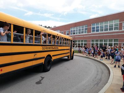 Rochester Memorial School 
As the school doors opened at Rochester Memorial School on the afternoon of Friday, June 14, teachers and administration carried on the tradition of playing instruments as a final farewell to the students as the school buses circled the parking lot, honking, as students laughed, waved, and cheered. Photos by Michelle Lynds
