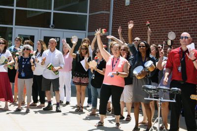 Fare Thee Well
Danni Kleimann led the school staff one last time on Wednesday, June 21, for the annual RMS student send-off. This year, the day marked Kleimann’s last day at RMS as she is retiring after 31 years. Kleimann is best known for directing the Shakespeare plays at RMS and for orchestrating the student send-off every summer. Kleimann passed her baton on to sixth grade teacher Tracy Forns to carry out the traditions. Photos by Jean Perry
