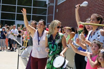 Fare Thee Well
Danni Kleimann led the school staff one last time on Wednesday, June 21, for the annual RMS student send-off. This year, the day marked Kleimann’s last day at RMS as she is retiring after 31 years. Kleimann is best known for directing the Shakespeare plays at RMS and for orchestrating the student send-off every summer. Kleimann passed her baton on to sixth grade teacher Tracy Forns to carry out the traditions. Photos by Jean Perry
