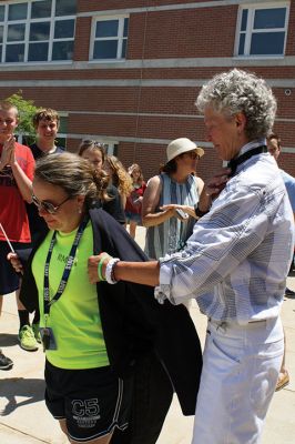 Fare Thee Well
Danni Kleimann led the school staff one last time on Wednesday, June 21, for the annual RMS student send-off. This year, the day marked Kleimann’s last day at RMS as she is retiring after 31 years. Kleimann is best known for directing the Shakespeare plays at RMS and for orchestrating the student send-off every summer. Kleimann passed her baton on to sixth grade teacher Tracy Forns to carry out the traditions. Photos by Jean Perry
