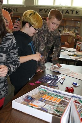 RMS STEAM Night
Rochester Memorial School hosted a STEAM night (Science, Technology, Engineering, Arts, Mathematics) on Thursday, March 30, in the RMS library. Students and parents enjoyed various hands-on stations featuring materials such as wooden sticks, clips, and plastic straws for engineering and building, as well as technology stations using “ozobots” to explore robotics. Photos by Jean Perry
