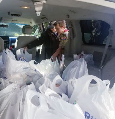 Rochester Scout
Rochester Lions Club members joined forces again on December 15 with Scout Troop 31 and other community volunteers at the Council on Aging to help make the COA’s Christmas Holiday Dinner program successful. Scouts packed 68 Christmas dinner bags of turkey, fresh vegetables, and all the fixings for delivery. The Rochester Lions Club works hard all year to raise the funds to provide these holiday meals at Thanksgiving and Christmas to area seniors and families in need.  
