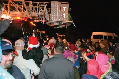 Oh, Christmas tree 
Ho! Ho! Ho! It’s the holiday season in Rochester now that the tree is lit followed by the arrival of jolly old Saint Nick via fire engine on December 4 to usher in the holiday season. The Rochester Memorial School band and chorus treated revelers to a festive performance, while Christmas poster winner Tessa Winslow had the honor of flipping the switch to light the holiday tree. Photos by Jean Perry
