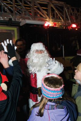 Rochester Tree Lighting
Monday, December 5, was the night of the annual Rochester Tree Lighting. Folks enjoyed festive music by the RMS chorus and band, and witnessed the grand entrance of Santa Claus aboard Rochester’s big yellow fire ladder truck with lights blazing and sirens sounding. Photos by Jean Perry
