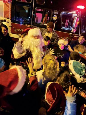 Rochester’s Tree Lighting
Rochester’s star-topped tree outside the Town Hall is dazzling this year with its new multi-colored lights lit for the first time on December 3 for the annual Rochester tree lighting ceremony. The RMS band and chorus kept the festive music going all the way up to Santa’s exciting arrival via fire truck. Photos by Jean Perry
