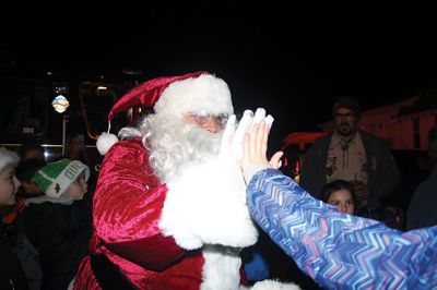 Rochester’s Tree Lighting
Rochester’s star-topped tree outside the Town Hall is dazzling this year with its new multi-colored lights lit for the first time on December 3 for the annual Rochester tree lighting ceremony. The RMS band and chorus kept the festive music going all the way up to Santa’s exciting arrival via fire truck. Photos by Jean Perry
