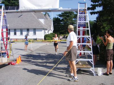 Rochester Road Race
Joanne Matthews, of Dartmouth, crosses the finish line as the womens winner at the fourth-annnual Rochester Road Race, which took place on Saturday, August 15. Photo by Adam Silva
