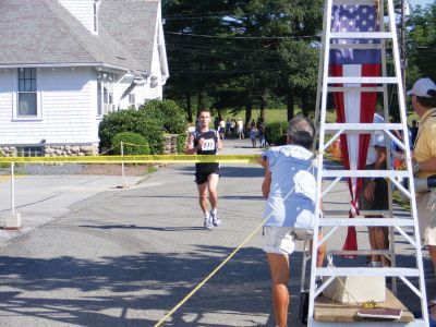 Rochester Road Race
Julien Di Maria, of Lexington, crosses the first place finish line at the fourth-annual Rochester Road Race and shattered the races previous record. The race took place on Saturday, August 15 and started on Dexter Lane near the Rochester Police Station. Photo by Adam Silva.
