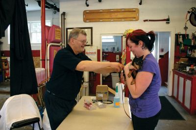 Rabies Clinic
Dr. Phil Gaudet and assistant Ashley Leaver took care of the pooches at an October 2, 2011 Mattapoisett rabies clinic at the fire station. Photo by Robert Chiarito.
