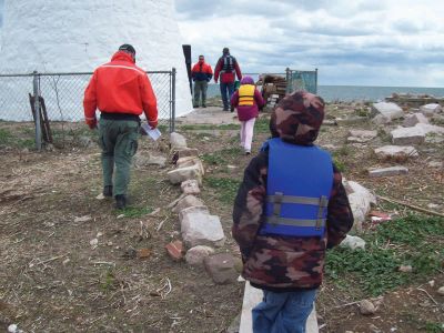 Ram Island Adventure
On a cold and windy day, the intrepid crew of the Marion Natural History Museum afterschool group joined the Marion Harbormaster's office to venture to one of the only nesting sites of the Roseate Tern before the endangered animal returned for the year. Photo courtesy of Elizabeth Leidhold.
