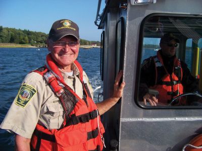 Ram Island Adventure
Pete Borsari and Isaac Perry of the Marion Harbormasters office remain cheery despite strong winds that redirected students on Marion Natural History Museums harbor trip to Ram Island, instead of the planned destination of Bird Island. Participants enjoyed a lovely, sunny day on the water learning about the harbor. Photo courtesy of Elizabeth Leidhold
