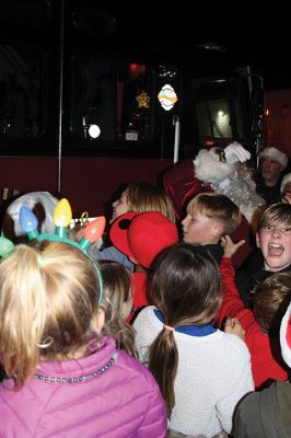 Rochester Christmas Tree
The town enjoyed a beautiful Monday evening and a large turnout, as children gathered on the steps of Town Hall to sing carols, and Santa Claus arrived with a Fire Department escort to hand out candy canes. Photos by Mick Colageo
