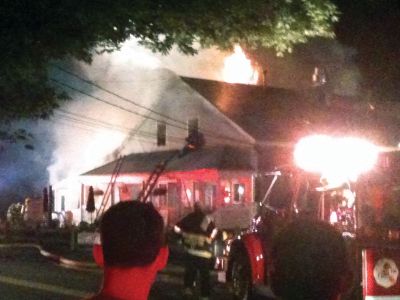 Bakery Fire
This reader submitted photo pays homage to the firefighters who responded to the July 28, 2011 blaze that destroyed the Rochester Bakery and Cafe at 28 Marion Road. Photo by Michael Amato.
