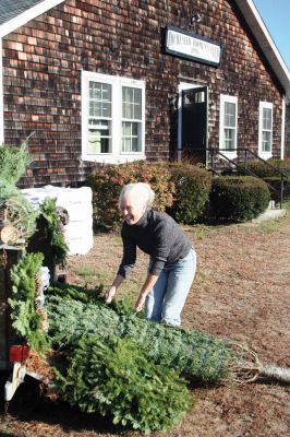 Tree Sales
'Tis the season, once more! On the Saturday after Thanksgiving, November 26, 2011, locals stopped by the Rochester Women's Clubhouse to pick up their fresh wreaths and trees. The proceeds from the sale helped the Rochester Women's Club purchase a new roof for their Clubhouse. The tree and wreath sale will continue on the weekends of December 3 and 4 and December 10 and 11 from noon to 2:00 pm. Left to right, Club members Nancy Boutin and Marsha Hartley helped sell wreaths and trees. Photo by Robert Chiarito
