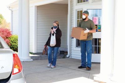 Rochester Council on Aging 
Rochester Council on Aging Director Cheryl Randall-Mach, Lorraine Thompson and a volunteer distribute meals at the COA. Photo by Kelly Smith
