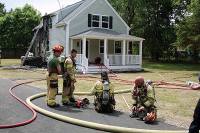 Rochester House Fire
A Memorial Day morning house fire on High Street in Rochester was brought under control by the Rochester Fire Department with assistance from Wareham, Marion, Mattapoisett and Acushnet departments. Photos by Mick Colageo
