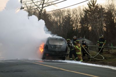 SUV Fire
An SUV was completely consumed by a fire in Rochester on Braley Hill Road, on Saturday evening, January 7, 2012. A passing motorist saw the flames and helped direct the occupants to safety. No injuries were reported, but Police Chief Paul Magee reported that the vehicle was a "total loss". Photo by Laura Fedak Pedulli. January 12, 2012 edition
