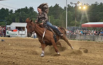 Rochester Rodeo
The second of the bi-weekly rodeo was held at the Rochester Fair Grounds this past Saturday by New England Rodeo. Present were over 20 professional bull riders from New England, Latin America, and Brazil. There were also professional barrel riders and mounted shooters. There were some young cowboys and cowgirls who also gave it their best to stay on a bucking pony. Children under 14 years of age were invited to the field to participate in competitive games to win a ribbon. Photos by Michael J. DeCicco & Hea
