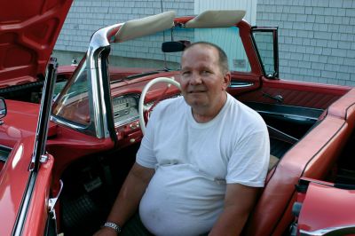 Car Show
Cindy Bristol, left, and Charles Rucker, right, pose in front of their 1959 Ford Galaxie. The car is Ford Geranium pink and has only been driven 70,000 miles in 50 years. The car is named for the star pattern that decorates the front grill. The Galaxie was one of many restored antique cars that filled Shipyard Park at the 2009 Mattapoisett Heritage Days car show. Photo by Anne O'Brien-Kakley
