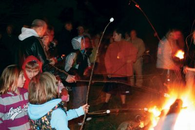 Moonlit Salty
Everyone had a blast at Saltys Moonlight Soiree at Dunseith Gardens on November 7, 2009. The Mattapoisett Land Trust provided sticks, marshmallows, chocolate, graham crackers, and entertainment. Children roasted their marshmallows while they enjoyed Big Ryan from Big Ryans Tall Tales. Photo by Anne OBrien-Kakley.
