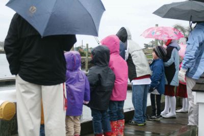 Santa's Arrival
Marion children gave a rock stars welcome to Santa Claus, who arrived at Marions Annual Holiday Stroll by boat on December 13. The pouring rain didnt stop Santa from spreading candy and holiday cheer to the crowd of exciting children. Clydesdale horses waited patiently to take visitors on a stroll through the village, and the town Christmas tree was lit at Bicentennial Park. Photo by Anne OBrien-Kakley.
