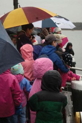 Santa's Arrival
Marion children gave a rock stars welcome to Santa Claus, who arrived at Marions Annual Holiday Stroll by boat on December 13. The pouring rain didnt stop Santa from spreading candy and holiday cheer to the crowd of exciting children. Clydesdale horses waited patiently to take visitors on a stroll through the village, and the town Christmas tree was lit at Bicentennial Park. Photo by Anne OBrien-Kakley.
